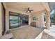 Inviting outdoor patio with stylish rug, ceiling fan, and view of the pool at 13587 Vancanza Dr, Venice, FL 34293