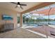 Inviting outdoor patio with stylish rug, ceiling fan, and view of the pool at 13587 Vancanza Dr, Venice, FL 34293