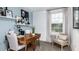 Bright office featuring a wooden desk, stylish decor and a comfortable chair near the window at 15165 Cuzcorro Ct, Nokomis, FL 34275