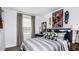 Neutral bedroom features natural light, a study desk, a full sized bed and sporty decor at 15173 Cuzcorro Ct, Nokomis, FL 34275