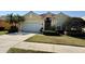Charming single-story home boasts a well-manicured lawn, two-car garage and a beautiful tile roof at 1620 San Silvestro Dr, Venice, FL 34285
