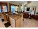 Open kitchen and living area featuring a breakfast bar, updated appliances, and a view to the patio at 1620 San Silvestro Dr, Venice, FL 34285