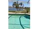 Inviting pool area offers serene water views, palm trees, and an ideal setting for relaxation at 1620 San Silvestro Dr, Venice, FL 34285