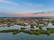 Expansive aerial view of a waterfront community featuring lush landscapes and serene waterways at 1643 Stanford Ln, Sarasota, FL 34231