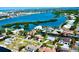 An aerial view shows a waterfront neighborhood, the home is circled in red with a beautiful canal at 1643 Stanford Ln, Sarasota, FL 34231
