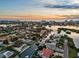 Stunning aerial view of waterfront homes at sunset near coastal waters at 1643 Stanford Ln, Sarasota, FL 34231