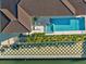 An aerial perspective showcases the pool, patio, and waterfront views, enhancing the property's appeal at 1643 Stanford Ln, Sarasota, FL 34231