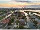 An aerial view features a waterfront property, adjacent canal, residential neighborhood, and boats, perfect for boating enthusiasts at 1643 Stanford Ln, Sarasota, FL 34231