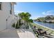 Backyard patio featuring a tiled patio and landscape design with water views at 1643 Stanford Ln, Sarasota, FL 34231