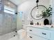 This bathroom features modern fixtures, a glass shower, and decorative mirror, creating a serene space at 1643 Stanford Ln, Sarasota, FL 34231