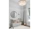 Charming Bedroom with a vintage crib and decorative chandelier, creating a serene space at 1643 Stanford Ln, Sarasota, FL 34231