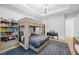 Spacious bedroom with a unique bunk bed, piano, modern light fixture, and stylish decor at 1643 Stanford Ln, Sarasota, FL 34231