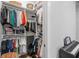 Large closet with shelves and hanging storage provides ample space for clothes and accessories at 1643 Stanford Ln, Sarasota, FL 34231