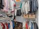 Organized walk-in closet with shelving and hanging space for clothes and accessories at 1643 Stanford Ln, Sarasota, FL 34231