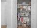 Organized closet with built-in shelving and hanging rods, offering plenty of storage space at 1643 Stanford Ln, Sarasota, FL 34231
