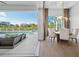 Open dining area featuring backyard, pool views, with seamless transition to outdoor living space at 1643 Stanford Ln, Sarasota, FL 34231