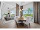 Bright dining room with a modern light fixture, patio access, and views of the backyard pool at 1643 Stanford Ln, Sarasota, FL 34231