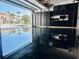 Garage with epoxy flooring, custom cabinets, and ample storage space at 1643 Stanford Ln, Sarasota, FL 34231