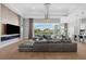 Bright living room featuring a modern fireplace, sleek design elements, and access to the outdoor lanai at 1643 Stanford Ln, Sarasota, FL 34231