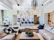Spacious living room showcases modern design and flows seamlessly into the kitchen and dining area at 1643 Stanford Ln, Sarasota, FL 34231