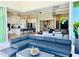 Spacious living room flows seamlessly into the kitchen, with modern decor and sliding glass doors at 1643 Stanford Ln, Sarasota, FL 34231