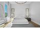 Bright main bedroom with large windows, stylish lighting, and minimalist decor for a serene space at 1643 Stanford Ln, Sarasota, FL 34231