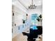 Bright home office with custom shelving, modern desk, and stylish decor at 1643 Stanford Ln, Sarasota, FL 34231