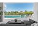 Beautiful backyard with a pool, spa, and a view of tropical landscaping and neighboring homes at 1643 Stanford Ln, Sarasota, FL 34231