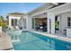 Inviting backyard pool and outdoor living area with seamless access to the home's interior at 1643 Stanford Ln, Sarasota, FL 34231