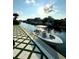 A motorboat is docked along a paver stone backyard near a waterfront canal at 1643 Stanford Ln, Sarasota, FL 34231