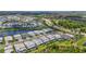 Expansive aerial view captures an attractive, neatly planned community with abundant water features and modern homes at 16434 Slate Pl, Bradenton, FL 34211