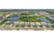 Beautiful aerial view of a Primary-planned community with large homes and picturesque water features at 16434 Slate Pl, Bradenton, FL 34211