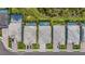 Aerial view showcases the layout of homes, driveways, lawns, and private pools in an upscale neighborhood at 16434 Slate Pl, Bradenton, FL 34211