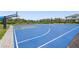 Outdoor blue basketball court with hoops, providing residents with recreational opportunities and space for sports activities at 16434 Slate Pl, Bradenton, FL 34211