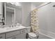 Clean bathroom featuring a tub with shower curtain and a vanity at 16434 Slate Pl, Bradenton, FL 34211