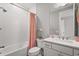 Bright bathroom features a shower-tub combo with white subway tile and a stylish vanity with elegant fixtures at 16434 Slate Pl, Bradenton, FL 34211