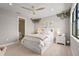 Bright bedroom with a platform bed, natural light, and stylish decor create a relaxing atmosphere at 16434 Slate Pl, Bradenton, FL 34211
