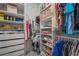 Walk-in closet featuring custom shelving and clothing racks for optimal storage solutions at 16434 Slate Pl, Bradenton, FL 34211