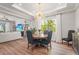 Elegant dining area with a round table, chandelier, and view of the backyard at 16434 Slate Pl, Bradenton, FL 34211