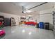 Spacious garage featuring ample storage, a lift, and parking for multiple vehicles at 16434 Slate Pl, Bradenton, FL 34211