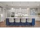 Stylish kitchen with a large island, pendant lighting, and modern stainless steel appliances at 16434 Slate Pl, Bradenton, FL 34211