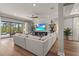 Comfortable living room with a large sectional sofa and an open view to the outdoor patio at 16434 Slate Pl, Bradenton, FL 34211