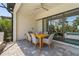Covered patio with a dining table, chairs, and sliding glass doors into the home at 16434 Slate Pl, Bradenton, FL 34211