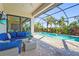 Relaxing outdoor lounge area with comfortable seating and view of the screened-in pool at 16434 Slate Pl, Bradenton, FL 34211