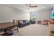 Bright play room with a blue couch, wood table, and toys at 16434 Slate Pl, Bradenton, FL 34211