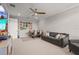Bright play room with a grey couch, wood table, and decorations at 16434 Slate Pl, Bradenton, FL 34211