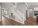 Interior view of a staircase with white railings and hardwood flooring at 16434 Slate Pl, Bradenton, FL 34211