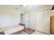 Spare bedroom with neutral walls, ceiling fan, closet, and adjacent sitting area at 1667 Oakland Rd, North Port, FL 34286