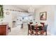 Bright dining area with a chandelier, wooden table, and decor display on the upper ledge at 1667 Oakland Rd, North Port, FL 34286
