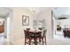 Cozy dining room with chandelier lighting next to an open floorplan at 1667 Oakland Rd, North Port, FL 34286